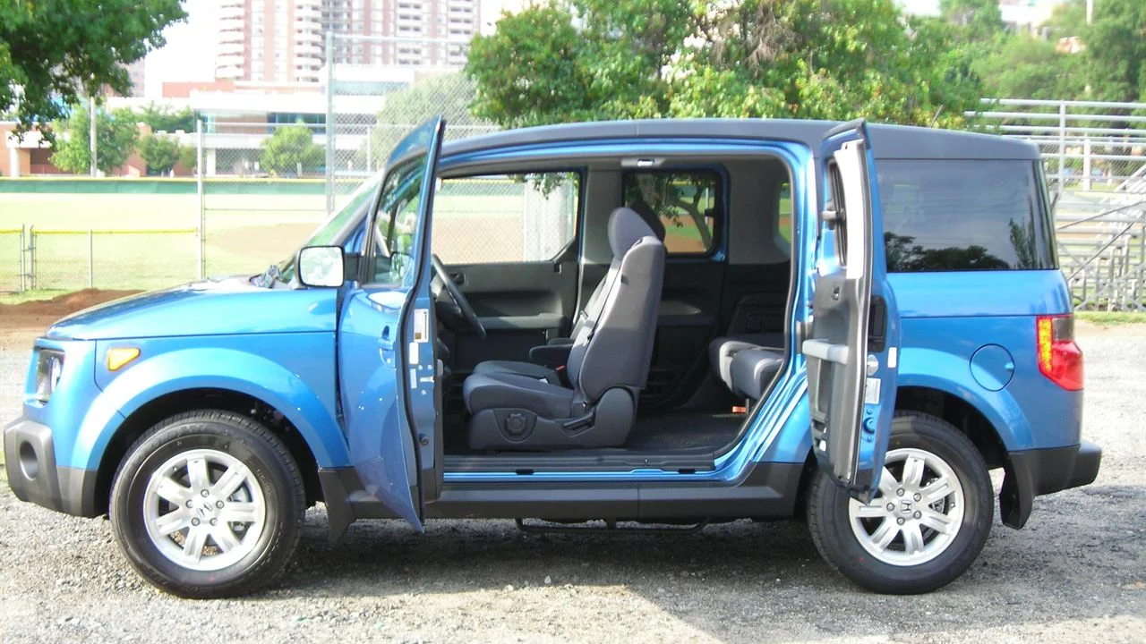 Original Honda Element in blue with all four doors open, showing the no-center-B-pillar clamshell-door design