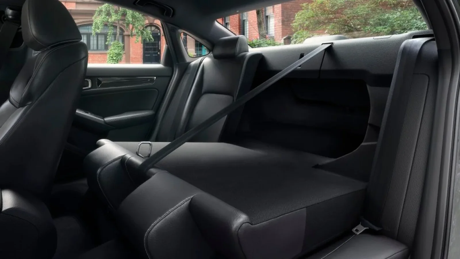 2026 Honda Civic Sedan rear seat with one side folded flat, Canadian model