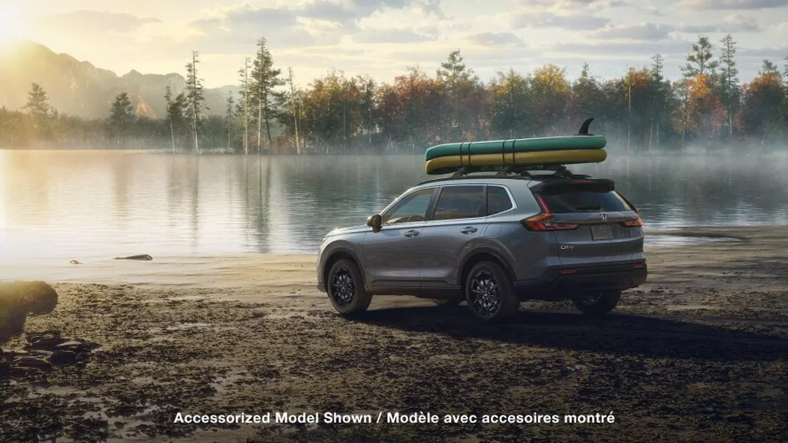 2026 Honda CR-V parked beside a lake with paddleboards on the roof, accessorized Canadian model