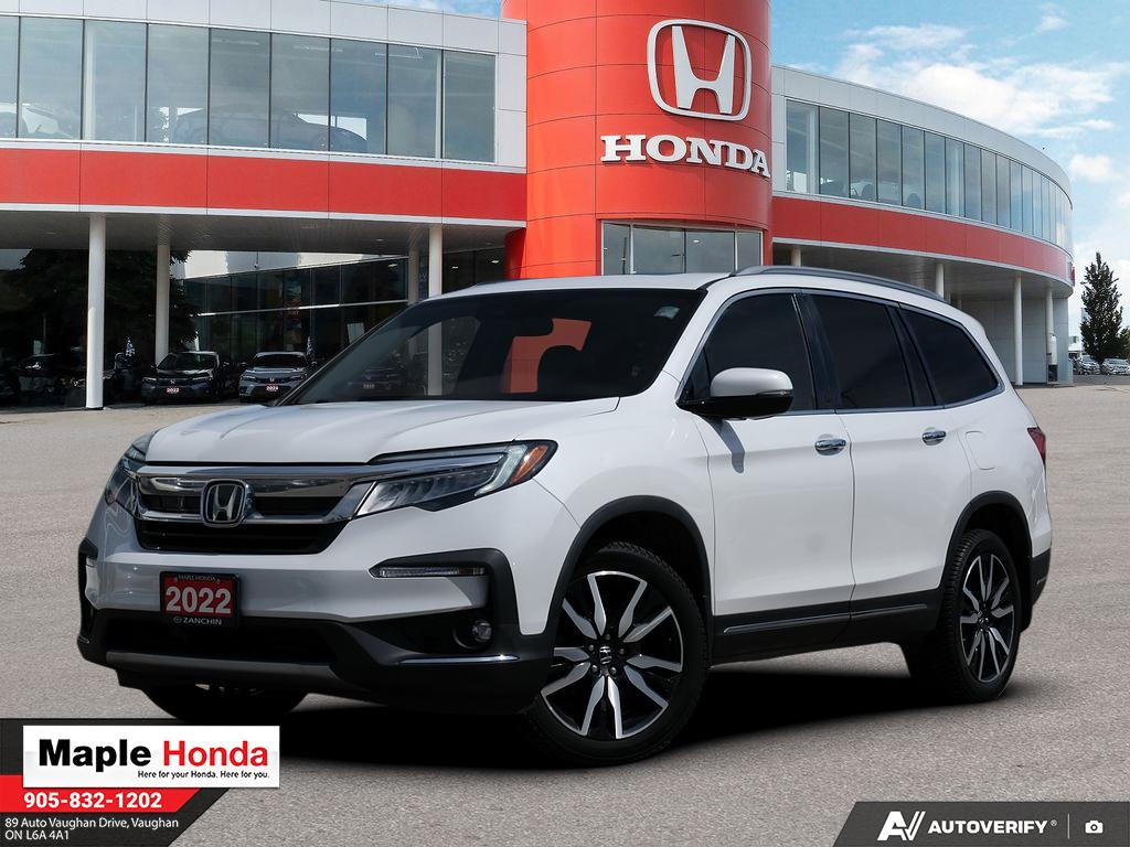 2022 Honda Pilot Touring 7-Passenger in White — front three-quarter view on the lot at Maple Honda