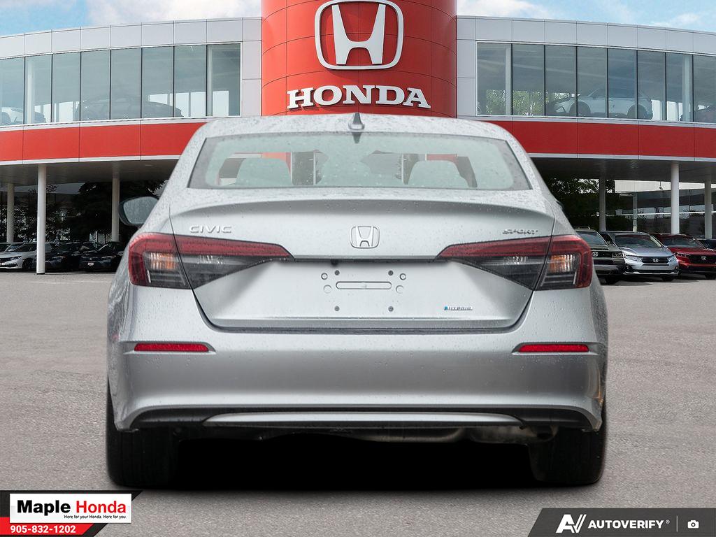 Rear straight-on exterior view with HYBRID badge