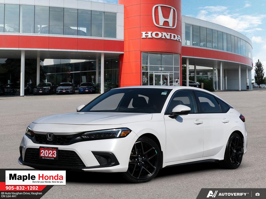 2023 Honda Civic Hatchback Sport Touring in White — front three-quarter view on the lot at Maple Honda in Vaughan